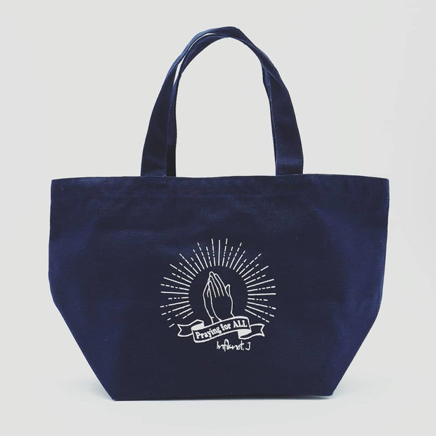 praying hands lunch tote bag